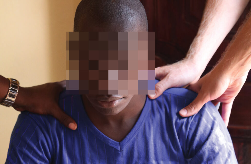 young man being prayed over